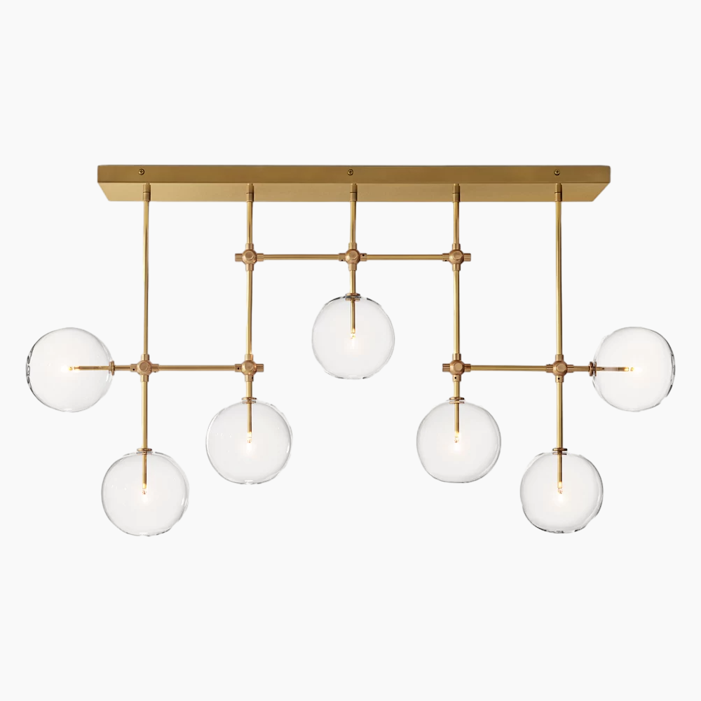 Zeamas Gold Chandelier: Luxurious handblown glass globes suspended on solid brass rods, radiating modern elegance.