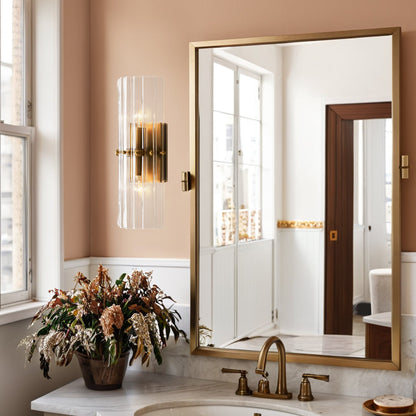 The Zeamas Wall Sconce's translucent ice-like glass surface casts a soft glow in your bathroom, creating a serene atmosphere for your morning routine.