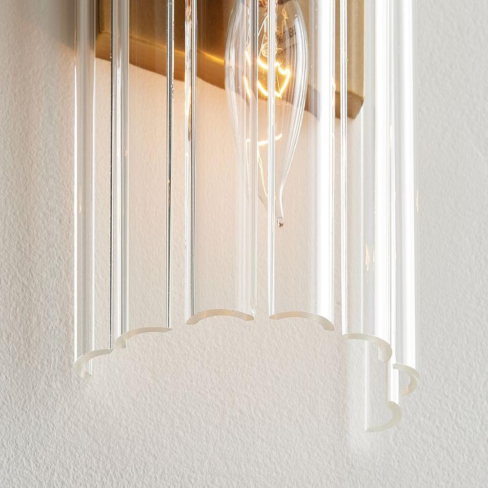 Crafted with meticulous attention to detail, the Zeamas Wall Sconce features a solid crystal glass shade that emits a gentle glow, creating a serene atmosphere in any room with its energy-efficient LED lighting.